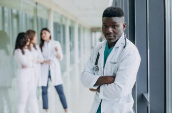 african-american-doctor-man-standing-corridor-hospital