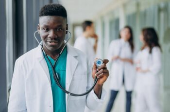 african-american-doctor-man-with-stethoscope-standing-corridor-hospital