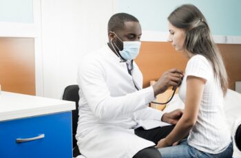 black-doctor-using-stethoscope