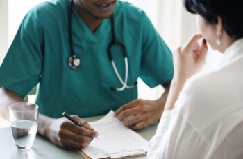 Doctor diagnose patient symptoms at the hospital